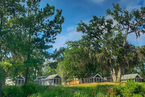 Small cabins along riverbank