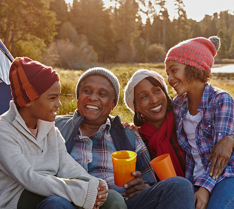 Family camping by lake