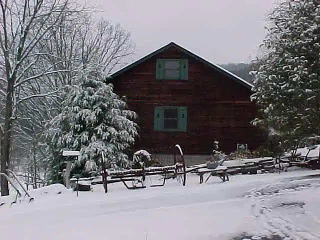 Log cabin in winter snow